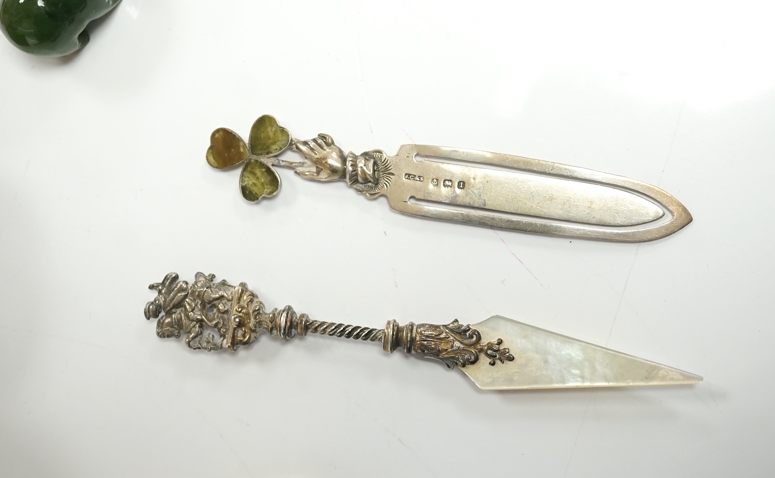 A small collection of mainly small silver items including a Victorian fruit knife, bookmarks, hare child's rattle, etc. Condition - fair